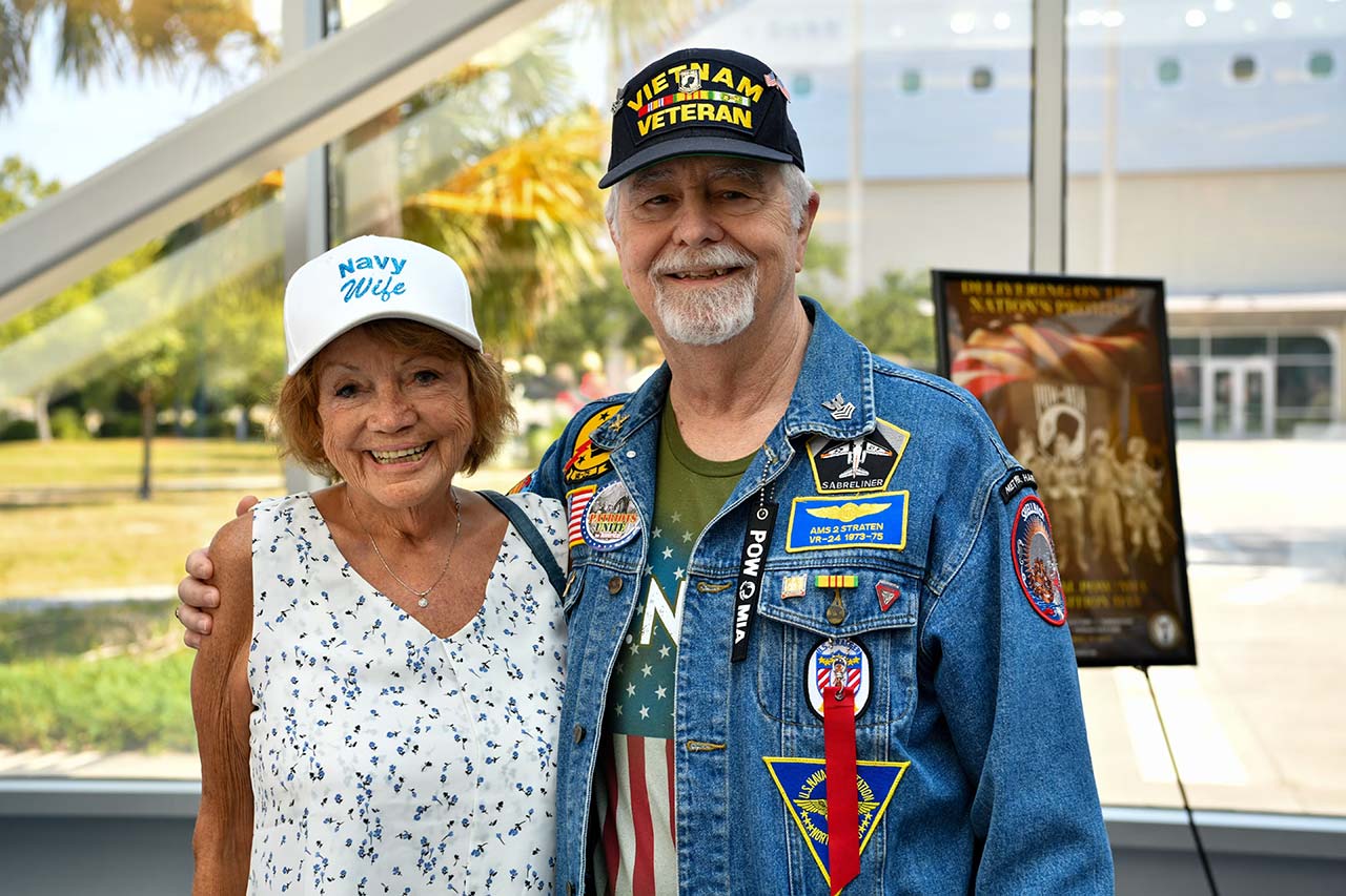 A happy elderly couple of a woman and a man who is a veteran.